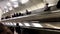 Top view of passengers in the subway station, public transport concept. Stock footage. Men and woman standing on the