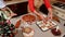 Top view of a pastry chef puts cut out figures from gingerbread dough on baking sheet. Christmas baking. Christmastime