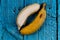 Top view of peeled bananas on a blue wooden table