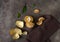 Top view of peeled tangerine and green leaves on a brown background