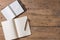 Top view of Pen, notebook, glasses, calculator,  smartphone on wooden table and copy space