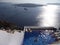 Top view of people in the pool in Santorini, Greece - holiday concept