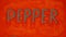 TOP VIEW: Pepper word on a red pepper background