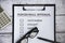 Top view of performance Appraisal checklist on clip board with pen, glasses and calculator background. Performance