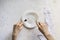 top view of person\'s hands on the table with empty plate design mock up designs