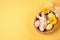 Top view photo of a basket with brightly decorated Easter eggs