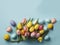 Top view photo of colorful easter eggs and bunches of yellow and pink tulips, light blue, copyspace, generative AI