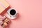 Top view photo of a gift box with a bow, macarons, and a coffee cup