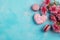 Top view photo of heart shaped sprinkle cookies, pink macarons