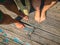 Top view, photo of a pair of bare feet on a wooden old floor. Photos on vacation, beach, summer