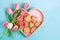 Top view photo of a tray of freshly baked heart-shaped cookies