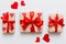 Top view photo of valentine day decorations gift box with red ribbon bow on colored background. Holiday gift boxes with