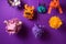 Top view photo of a variety of colorful piñatas in different shapes and sizes