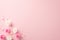 Top view photo of white and pink rose buds small hearts and sprinkles on pastel pink background with copyspace