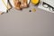 Top view photo of workplace keyboard glasses binder clips copybooks pencil glass of juice and plate with sandwiches on isolated