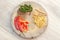 Top view picture of chili, fingerroot, and pepper on the wooden plate