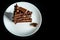 top view piece of chocolate cake served on on white plate