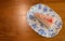 Top view of Piece of homemade taro cake in classic plate on table with copy space for text