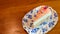 Top view of Piece of homemade taro cake in classic plate on table with copy space for text