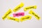 Top view of piece of sheet of pink and yellow paper with words 2018 goals,save money,quit smoking,lose weight,exercise,vacation an