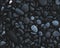Top view of a pile of dark stones - a good choice for natural patterned backgrounds