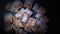 Top view of a pile of fifty euro banknotes on a black background