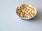 Top view of a pile of popcorn caramel popcorn in a plate on a glass table