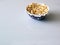 Top view of a pile of popcorn caramel popcorn in a plate on a glass table