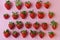 Top view of pile of strawberries on white surface with blank copy space