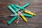 Top view of a pile of syringes and insulin syringes ready for injection at wooden background. Health care concept with copy space