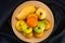 Top view pile of various ripe sweet tropical fruits in bamboo tray