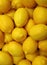 Top View of Pile of Vibrant Yellow Lemons, Vertical Photo