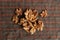 Top view of a pile of walnuts on a plaid fabric