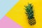 Top view of Pineapple on colorful table. Summer and tropical concept