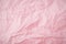 Top view of  pink crumpled paper background