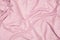 Top view of pink fabric retro glamour background. Textured