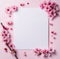 Top view pink perple background with happy cherry blossom arrangement on blank paper with light background