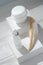 Top view of Pipet bottle and cream container on white boxes ann wooden table