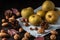 Top view of pippin apples on blue cloth, on wooden table with dry fruits and autumn leaves,