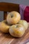 Top view of pippin apples, on wooden table, chair and red cloth, selective focus