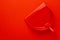 Top view of plastic dustpan on red background with copy space