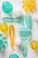 Top view of plastic massage tools roller and accessories on bright background