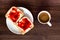 Top view on a plate with breakfast, two slices of bread with fruit marmalade, hot coffee