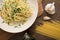 Top view of plate with cooked classic italian spaghetti aglio olio