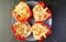 Top View of a Plate of Delectable Stuffed Bell Peppers Isolated on Black Table