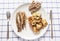 Top view of the plate of food consisting of fried fish, potatoes and crisp bread