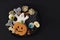 Top view of plate full of Halloween treats. Black background with copy space