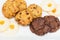Top view of a plate of oatmeal chocolate, shortbread cookies on a white background