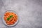 Top view plate Penne All`arrabbiata pasta cooked according to a traditional Italian recipe with copy space