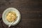 Top view plate of spaghetti AGLIO E OLIO on wooden background with copy space